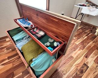 Cedar Chest by Lane. Items inside are Handmade Italian wool suits.
