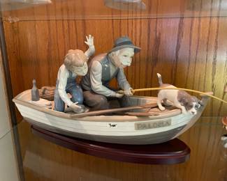 . . . great Lladro -- grandpa fishing with grandson and dog