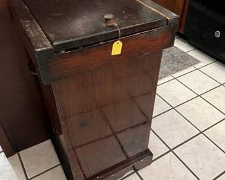 Wooden trash can. 