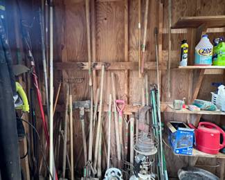 Assorted yard tools 
Propane tanks 
Garden items 