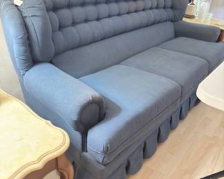 Blue couch, some damage