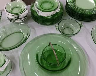 10 piece setting of green glass dishes.  In condition of never used.