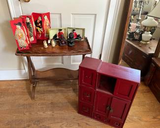 Asian inspired art, an Asian inspired jewelry box & a low wood table with a magazine rack