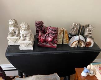 Assorted bookends on a gate leg table