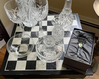Waterford crystal on a low checkers or chess table, with storage for pieces