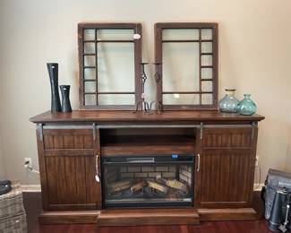 Architectural Salvage Window Panels, Farmhouse TV Console with Fireplace, vases, Wrought Iron Pair Candleholders
