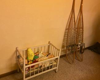 old doll crib with dolls large snow shoes