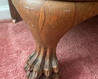 eagle claw foot on the lovely curved glass china cabinet 
