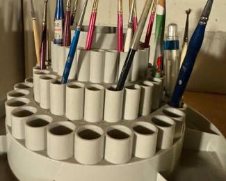 Caddy filled with brushes for ceramic, pottery or porcelain painting 