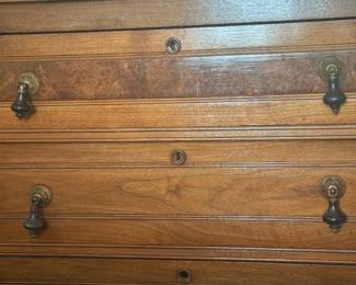 DETAIL OF THE ANTIQUE EAST LAKE OAK AND BURLED WALNUT DRESSER WITH MIRROR