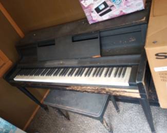 A Wurlitzer Console Piano,