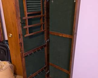 Wall jewelry armoire with mirrored door