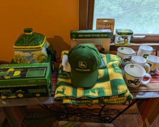 John Deere collectibles (Please note that the Model Tractor in box on left bottom corner is listed on our online auction) : Hats, mugs, towel, wall thermometers ...