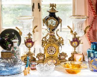 Multiple clocks, garniture sets, and glass, including Tiffany , Galle, Bohemian, French cut glass vases on pedestals, Epergne and Steuben.
