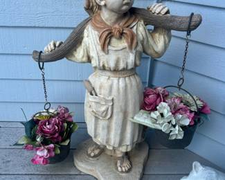 Statue of Girl Holding Water Pails