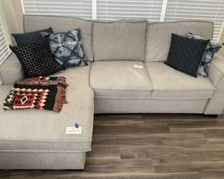 Sofa With Chaise In Grey Wool With Decorative Pillows And Blanket