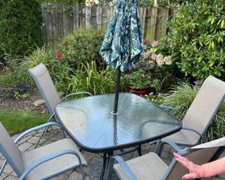 Patio table umbrella and four chairs 