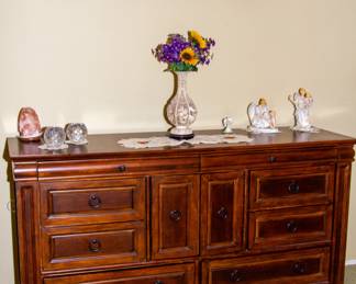 Wooden dresser with artwork displays