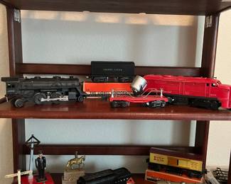 VINTAGE Lionel Trains - Assorted train collection in excellent shape. Includes cast iron engine, various train cars (metal and plastic), tracks and switches. Must see to appreciate!