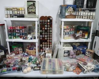 Threads! All colors and lots of quantity of quality threads. Also lighted houses with fabric and quilting themes.