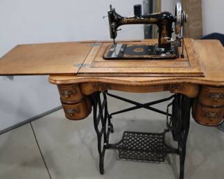 Minnesota "A" treadle sewing machine in original cabinet.