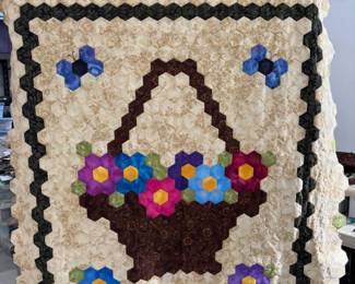 Flower basket quilt top center with lots of fabric for completion.