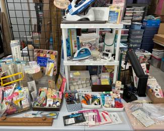 Oodles of sewing/quilting notions of all kinds. 2 different irons, pressing boards, OTT lights, quilting frames and more.