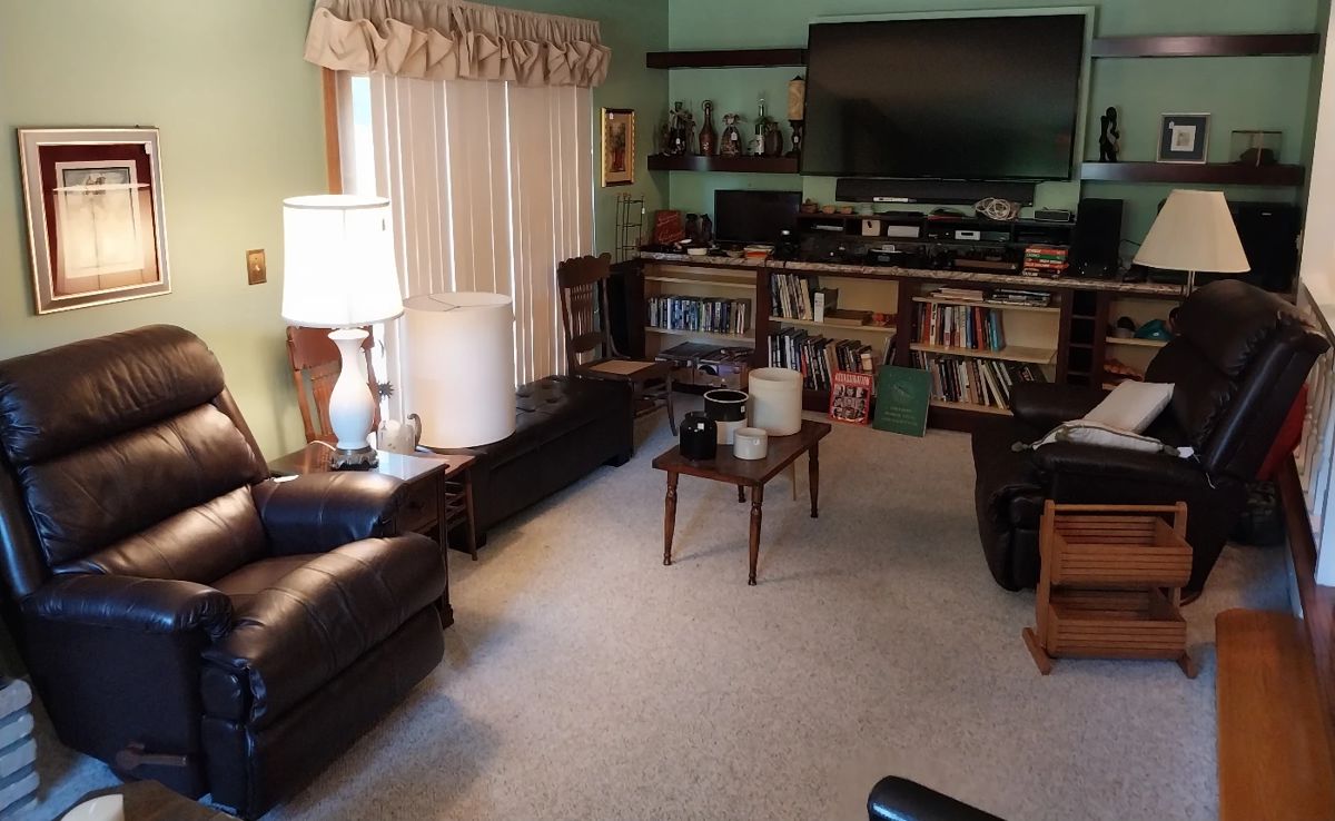 La Z Boy leather swivel rocker recliners, storage bench, Atari w/paddles, joystick, and games, Sony blu-ray player, Sony component system, Sony soundbar, Sony Bravia 65” TV, Bose soundlink mini, Canon EOS 630, iHome dock radio, Amazon echo dot