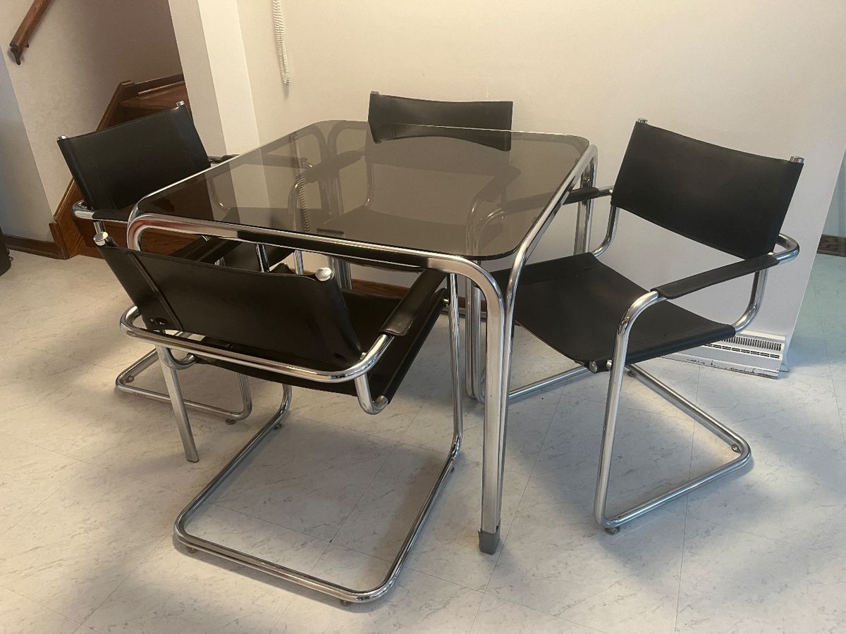 Black leather/chrome chairs and glass/chrome table