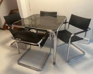 Black leather/chrome chairs and glass/chrome table