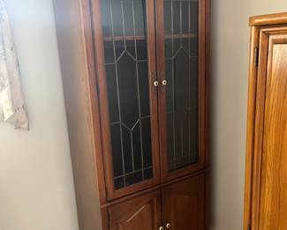 Storage cabinet with glass doors