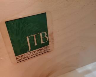 JTB stamp on shabby black dresser