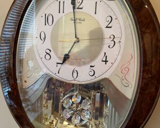 Swarovski small world wall clock