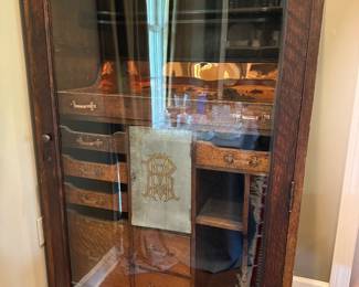 This is a bar with slide out drawers and an insulated compartment in the middle that holds an ice bucket. 38.5” wide and 62” tall