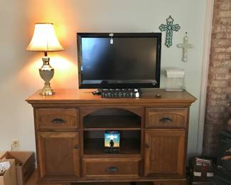 Oak entertainment cabinet, TV and lamp