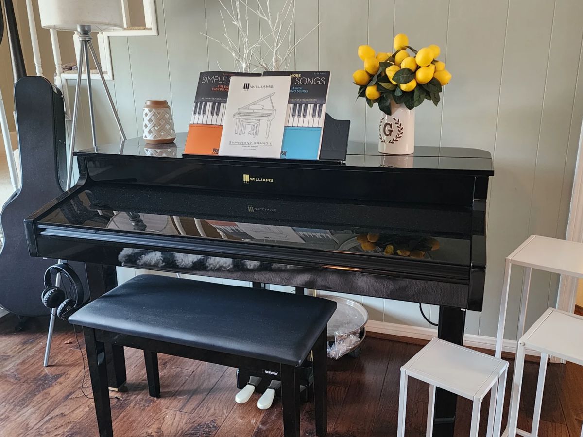 Williams Symphony Grand II Digital Piano with padded bench, owner's manual, and music books