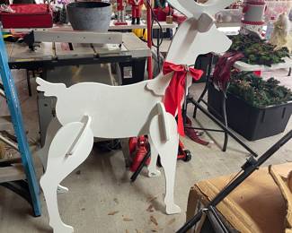 large selection of wood reindeer yard art