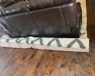 New area rug (rolled up behind couch)