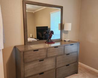 Beautiful, lightly used (maybe never used) bedroom suite.  Includes:  Queen bed with headboard, footboard, mattress, box spring, 2 nightstands, triple dresser with mirror 
