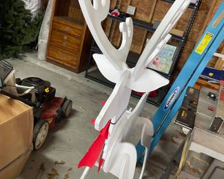 large selection of wood reindeer yard art