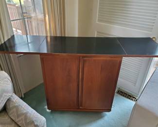 Buffet with slate top. Sides drop down when not in use.