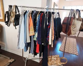 Quality clothing and purses - one of two racks