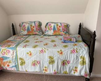 one of two matching twin beds with mattresses and box springs