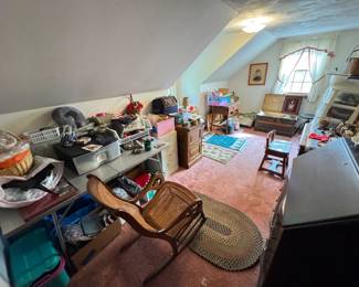 Braided rugs, rocking chairs, secretary desks