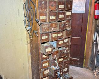 Antique apothecary style tool storage with many drawers