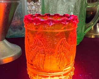 Amberina glass glowing red and yellow under 365nm UV light