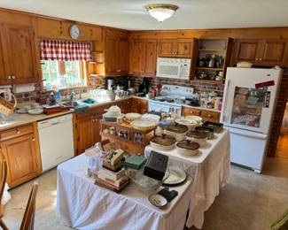 Kitchen items featuring vintage Pyrex and jewelry at Estate sale in Pelham Massachusetts Saturday August 31