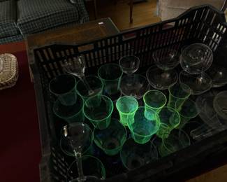 Antique glassware glowing green under 365nm ultraviolet black light 