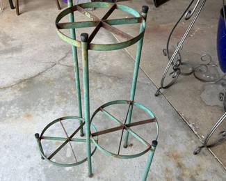 Vintage three-tier metal plant stand.