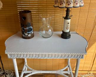 Wicker accent table.